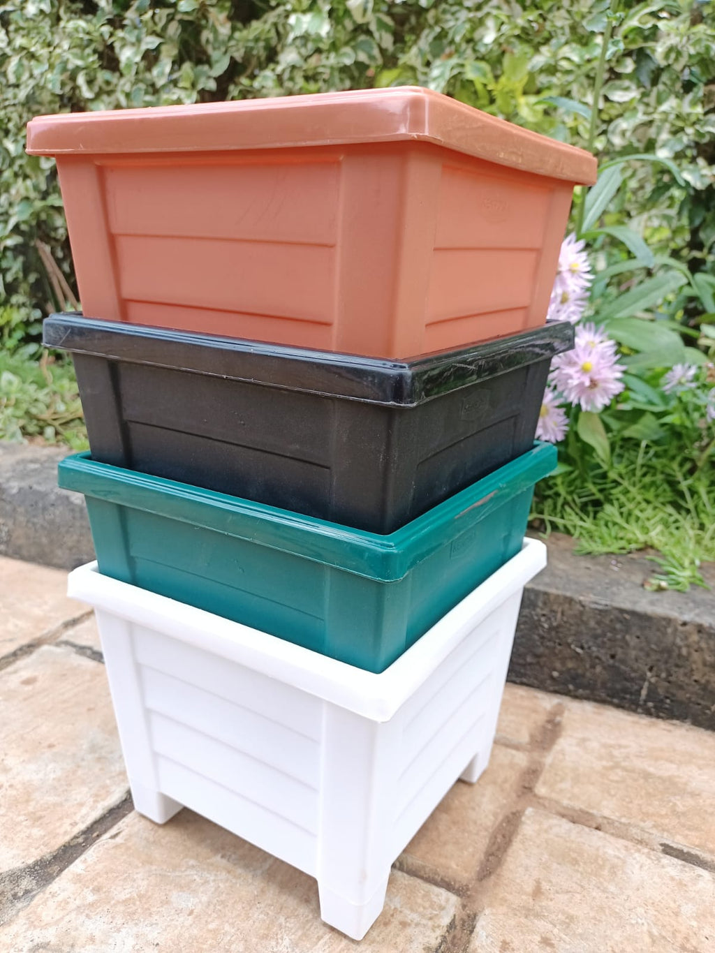 Kenpoly Square Planter No. 4 – all 4 colours stacked: Brown, Black, Green, White