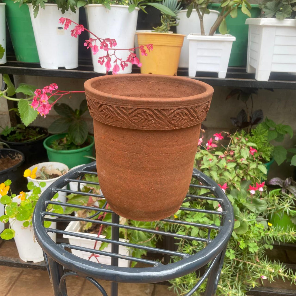 Decorative patterned rim on empty clay planter