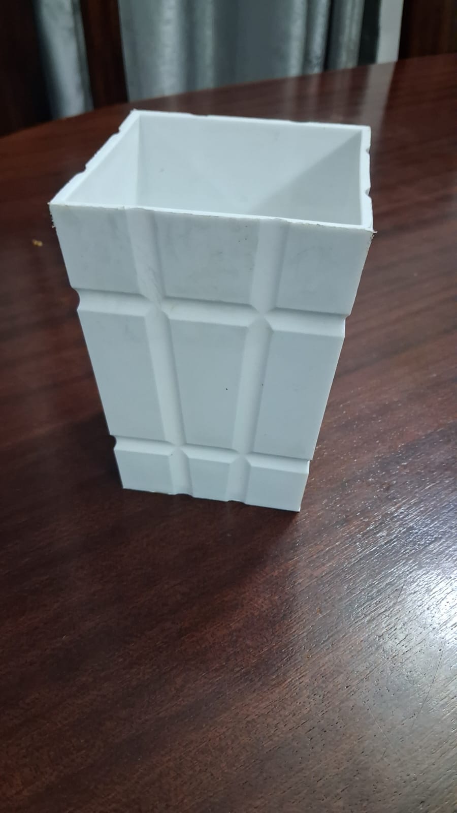 Actual white square grid-pattern pot viewed from the front