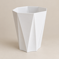 AI-generated square illustration of white faceted planter from front angle